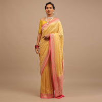 Canary Yellow Traditional Georgette Saree With Contrasting Peach Brocade Border And Jaal Work