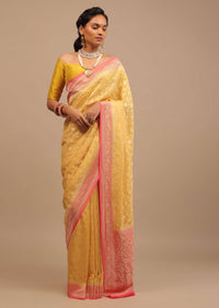 Canary Yellow Traditional Georgette Saree With Contrasting Peach Brocade Border And Jaal Work