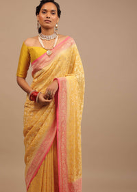 Canary Yellow Traditional Georgette Saree With Contrasting Peach Brocade Border And Jaal Work