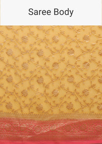 Canary Yellow Traditional Georgette Saree With Contrasting Peach Brocade Border And Jaal Work