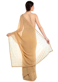 Dark beige saree adorn in gold and silver kundan embroidery only on Kalki