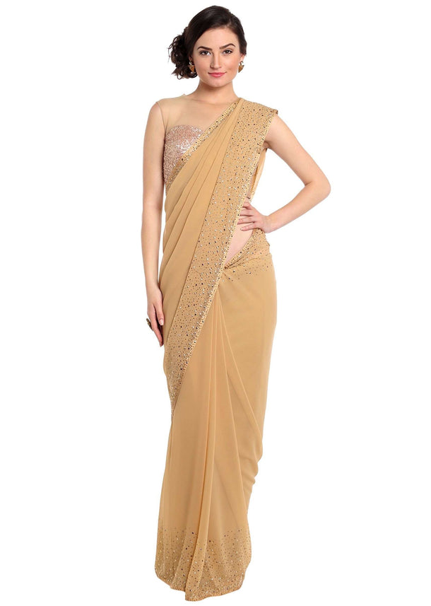 Dark beige saree adorn in gold and silver kundan embroidery only on Kalki