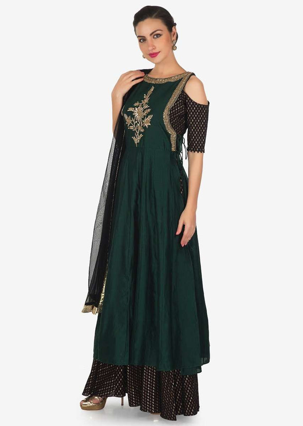 Black anarkali suit matched with dark green top layer adorn in cut dana and zardosi only on Kalki