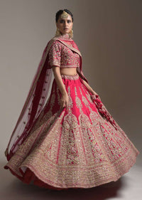 Dark Cranberry Pink Bridal Lehenga Choli In Raw Silk With Resham And Zari Embroidered Floral Kalis