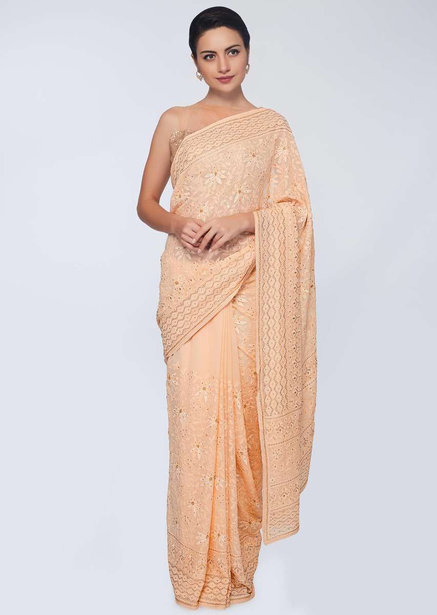 Dark cream georgette  saree featuring in floral embroidered jaal work