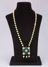 Dark cream pearl necklace with geometric shaped pendant with emerald green bead and kundan stone only on Kalki