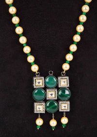 Dark cream pearl necklace with geometric shaped pendant with emerald green bead and kundan stone only on Kalki