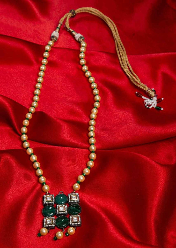 Dark cream pearl necklace with geometric shaped pendant with emerald green bead and kundan stone only on Kalki