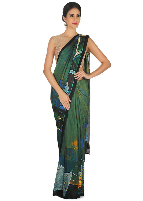 Dark green saree in abstract print with contrast border only on Kalki