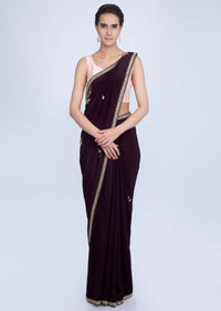 Dark violet satin crepe saree with embroidered butti and border only on Kalki