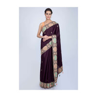 Dark violet silk saree with butti and heavy embroidered border only on Kalki