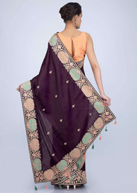 Dark violet silk saree with butti and heavy embroidered border only on Kalki