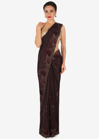 Dark brown saree in crepe with resham embroidery in floral motif only on Kalki