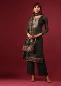 Deep Green Printed Palazzo Suit In Tussar Silk With A Stunning Potli Bag