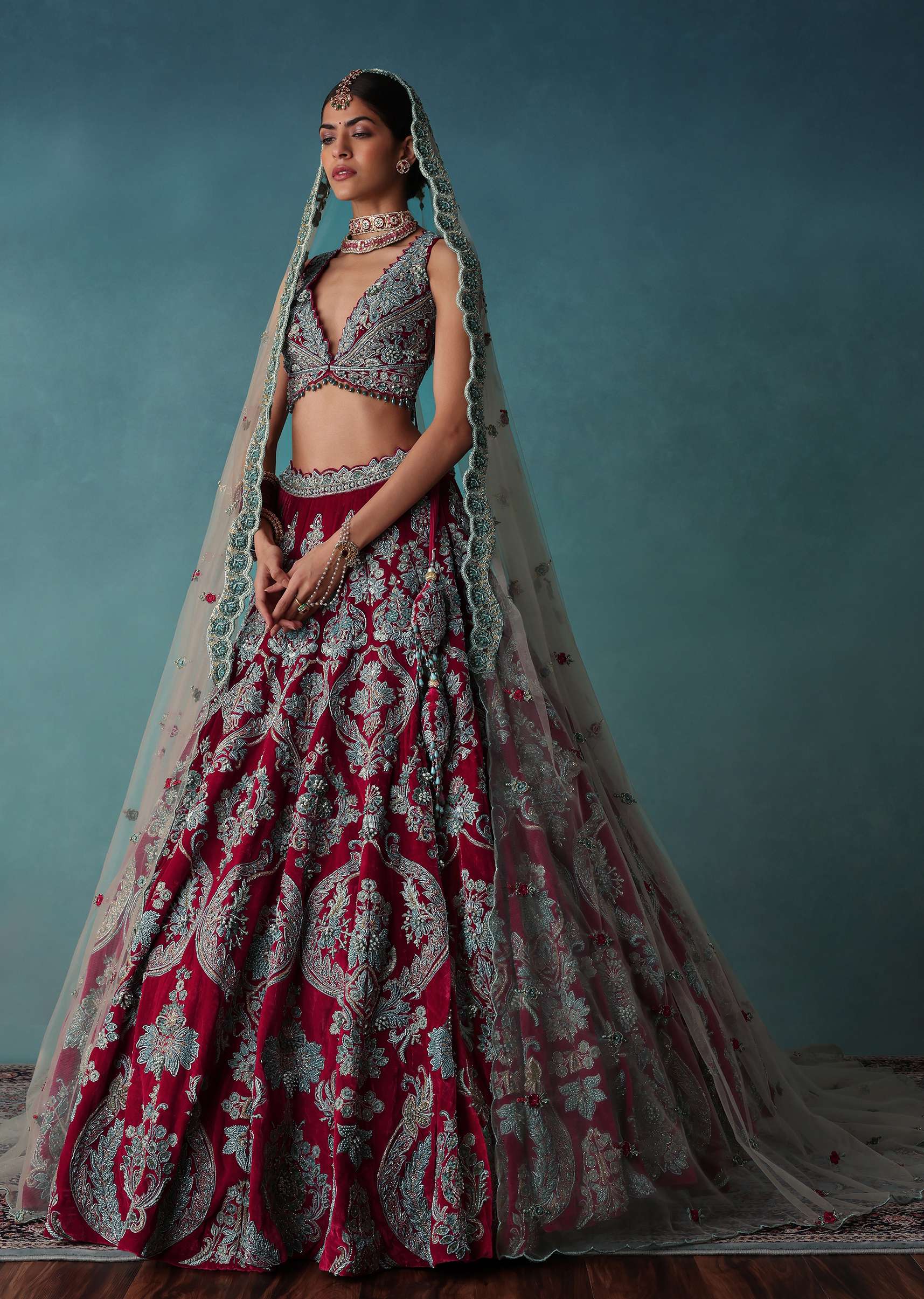 Deep Red Hand Embroidered Bridal Lehenga And blouse Set In Velvet