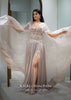 Doe Organza Gown With A Long Extended Cape Sleeves And A Plunging V Neckline