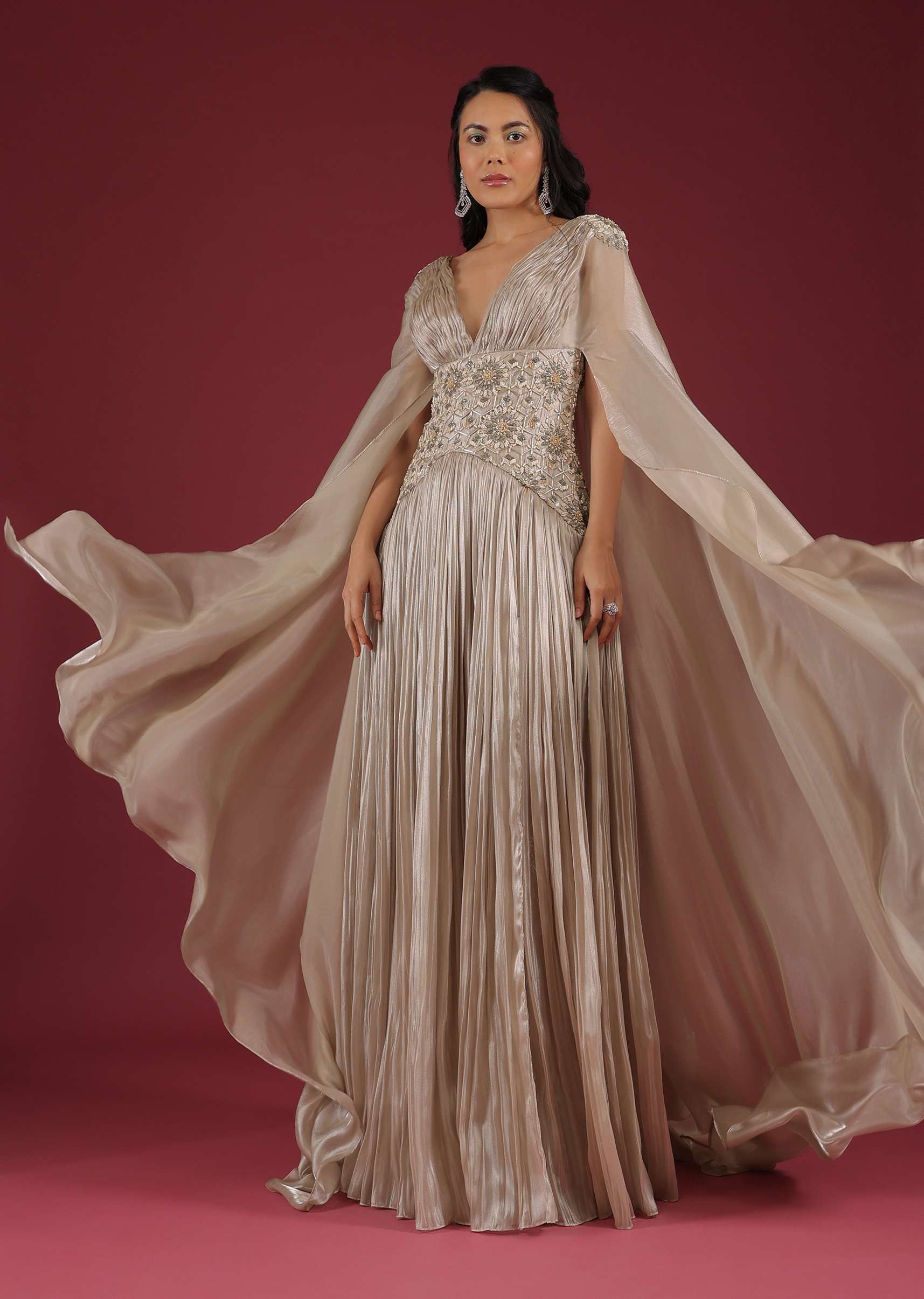Doe Organza Gown With A Long Extended Cape Sleeves And A Plunging V Neckline