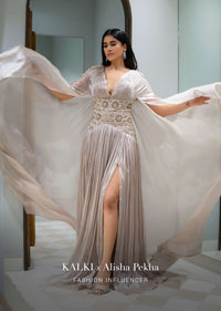 Doe Organza Gown With A Long Extended Cape Sleeves And A Plunging V Neckline