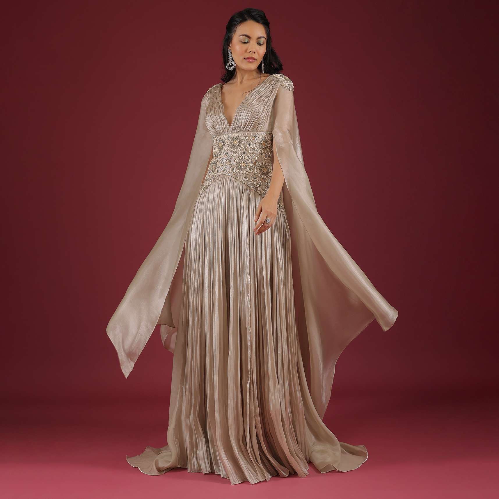 Doe Organza Gown With A Long Extended Cape Sleeves And A Plunging V Neckline