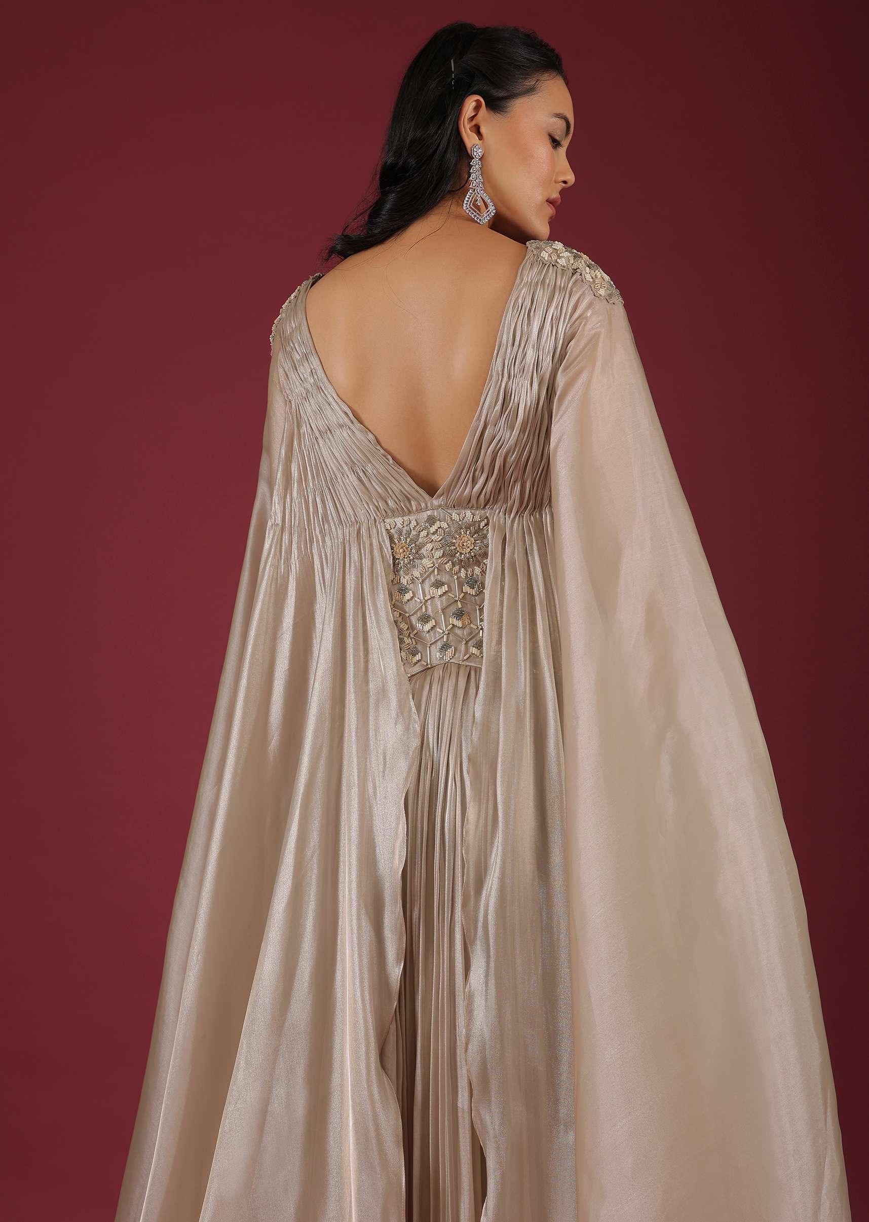 Doe Organza Gown With A Long Extended Cape Sleeves And A Plunging V Neckline