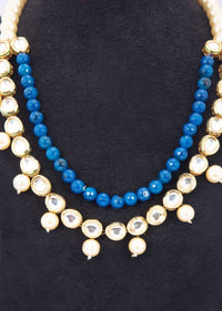 Double layer necklace adorn with cream pearls, kundan stone and round blue beads only on kalki
