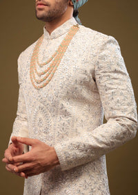 Pearl White Silk Sherwani Set With Exquisite Zari And Sequin Embroidery