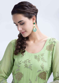 Elegant and classy long metal coated earring with emerald green stone only on Kalki
