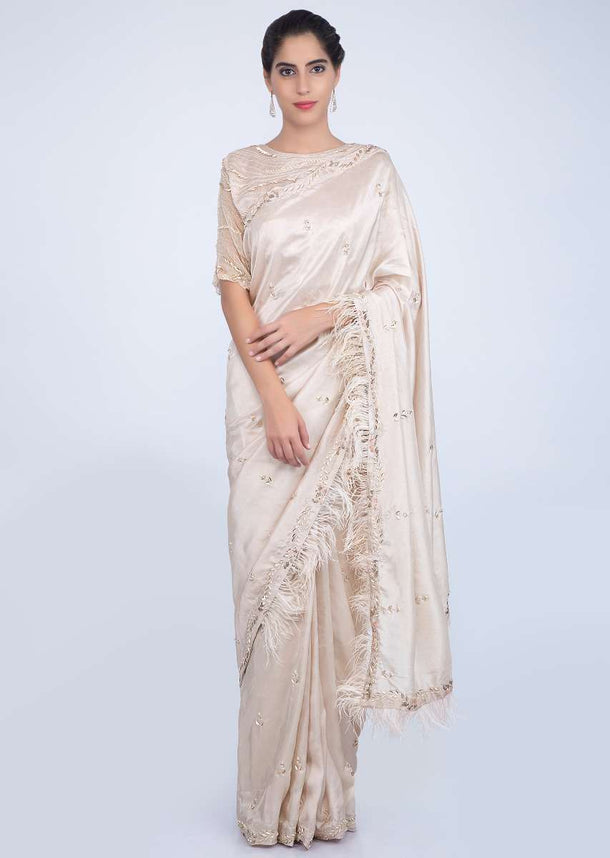 Ivory Saree With Embroidery And Feathers On The Border Online - Kalki Fashion