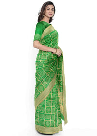 Emerald green banarasi silk saree with traditional motifs only on Kalki