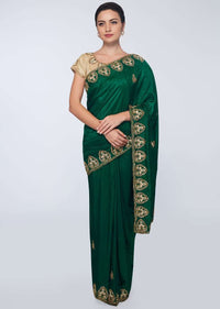 Emerald green  cotton silk saree in embroidered butti and border 