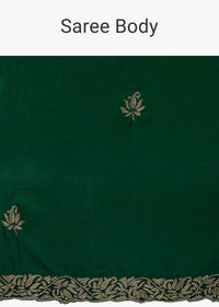 Emerald green satin saree embellished with cut dana embroidered butti and border