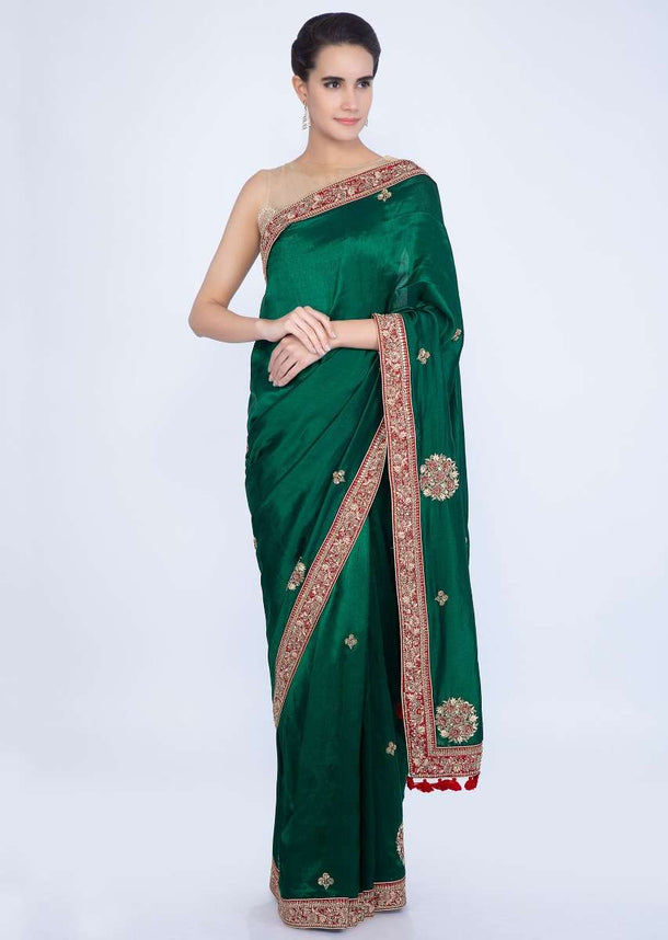 Emerald green silk saree with embroidered butti and border only on Kalki