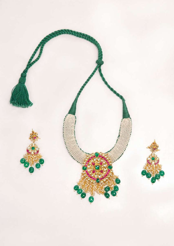 Emerald green thread necklace set with jadau pendant only on Kalki