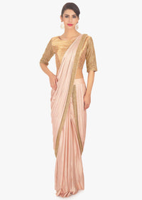 Fancy fabric peach blouse with lycra saree skirt in ready plated pre stitched pallo only on Kalki