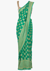 Fern green georgette saree in weaved butti and border only on Kalki