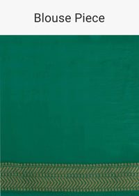 Fern green georgette saree in weaved butti and border