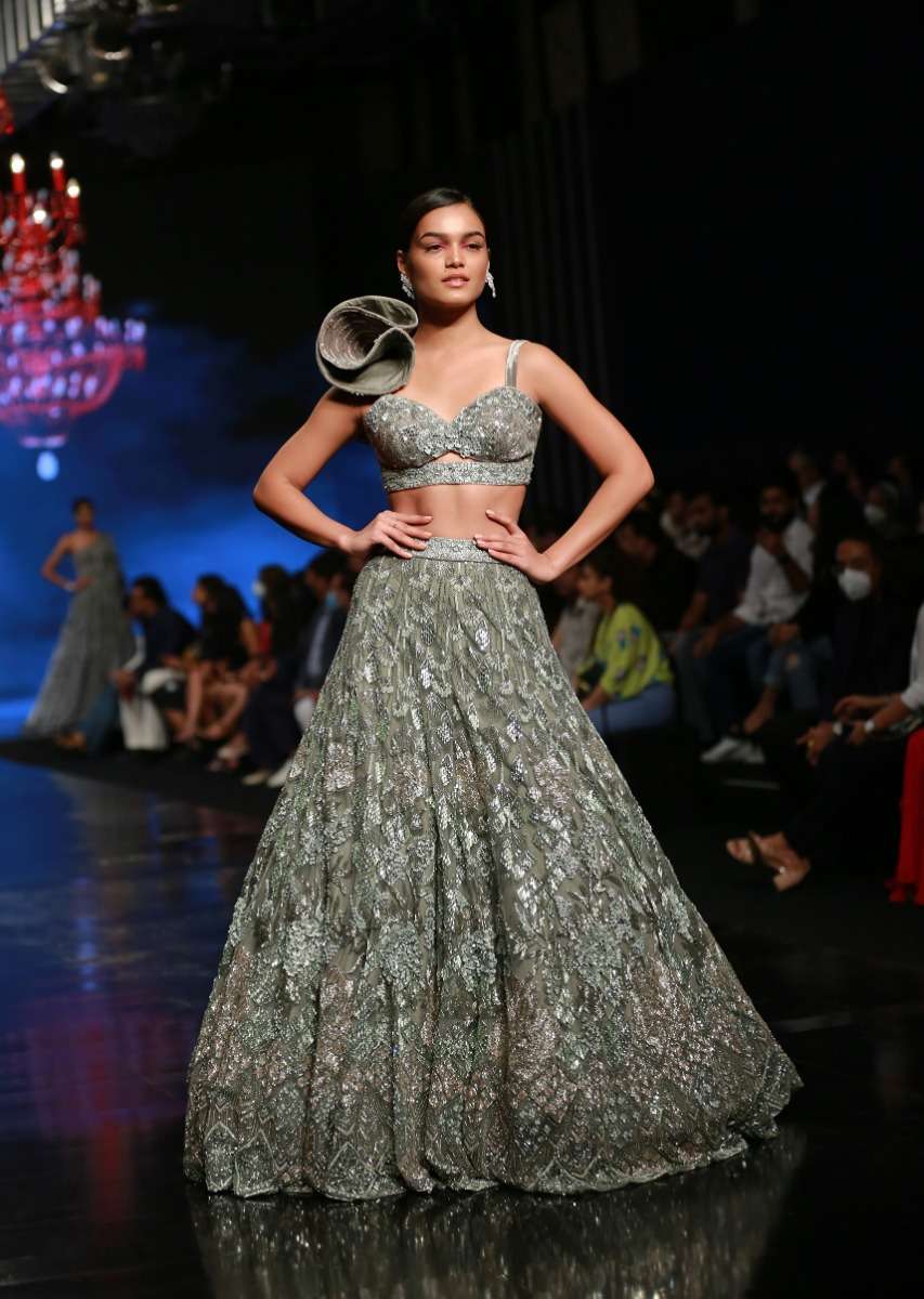 Fern Green Lehenga Choli In Net With Stone Hand Embroidered Floral Motifs And Fancy Origami Cones On The Shoulder