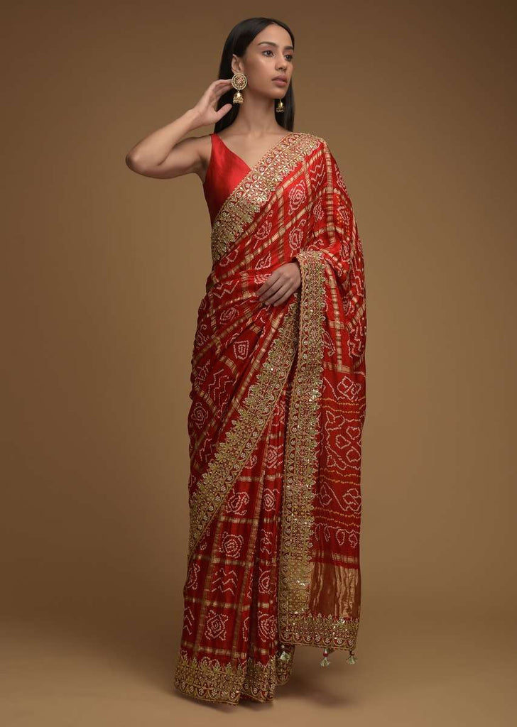 Fiery Red Saree With Bandhani Print And Gotta Patti Work Paired With Unstitched Blouse