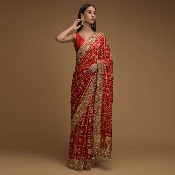 Fiery Red Saree With Bandhani Print And Gotta Patti Work Paired With Unstitched Blouse