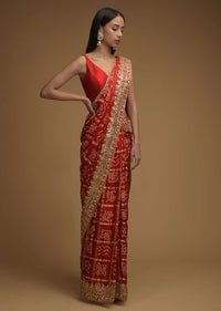 Fiery Red Saree With Bandhani Print And Gotta Patti Work Paired With Unstitched Blouse