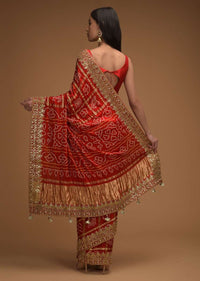 Fiery Red Saree With Bandhani Print And Gotta Patti Work Paired With Unstitched Blouse