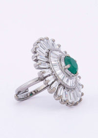 Floral shape ring adorn with buggle beads and emerald green stone only on Kalki