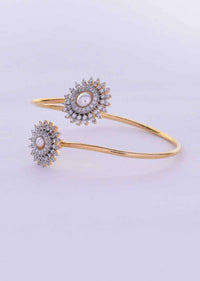 Floral shaped adjustable kada studded with cz stones and pearls only on Kalki