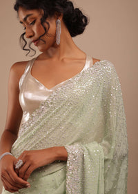 Foam Green Chiffon Saree In 3D Silver Petal And Floral Motifs Embroidery With Sequins Cascading Down