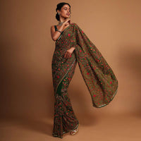 Forest green georgette saree with floral jaal embroidery