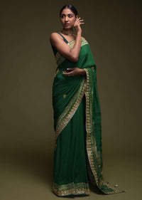 Forest Green Saree In Crepe Silk Blend With Gotta Patti Embroidered Buttis And Woven Border