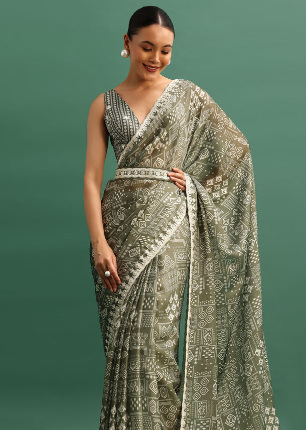 Forest Green Printed Satin Saree With Sequins Embroidered Border And Unstitched Blouse