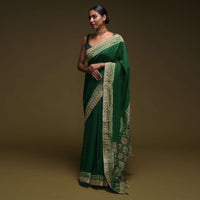 Forest Green Saree In Crepe Silk Blend With Gotta Patti Embroidered Buttis And Woven Border