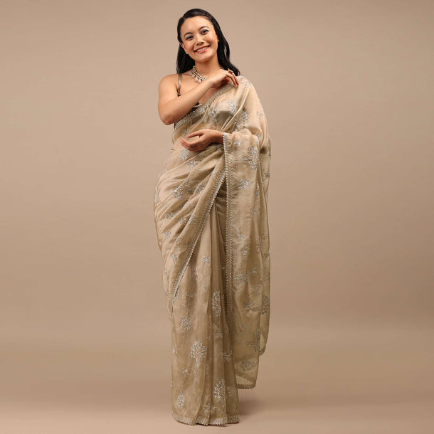 Frosted Almond Tissue Saree In Zardozi Embroidery Buttis, Leafy Motifs Embroidery Detailing On Border
