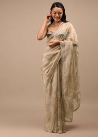 Frosted Almond Tissue Saree In Zardozi Embroidery Buttis, Leafy Motifs Embroidery Detailing On Border